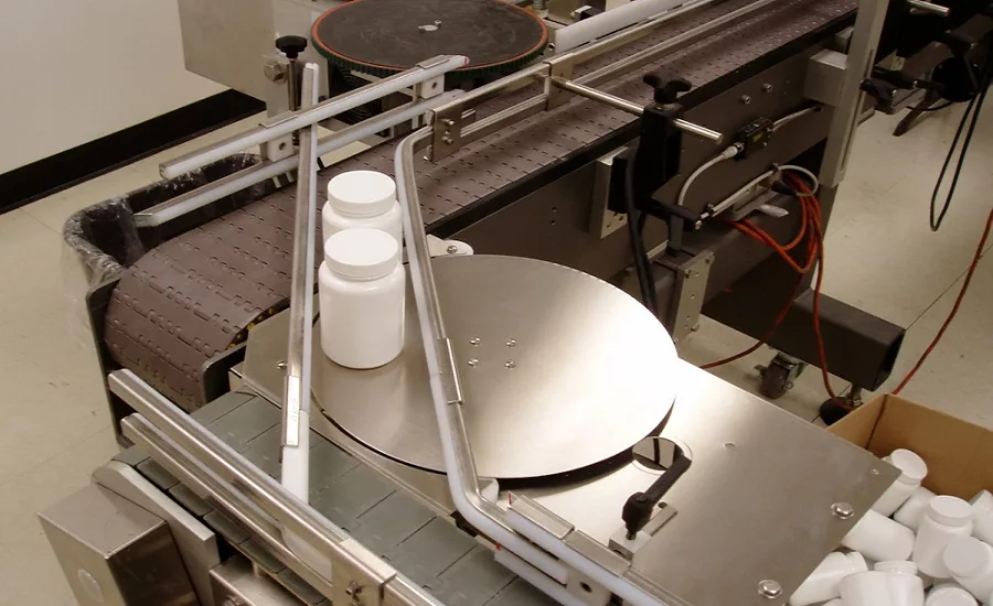 Rotary Turntable Transfers Filled Bottles to/from Conveyors