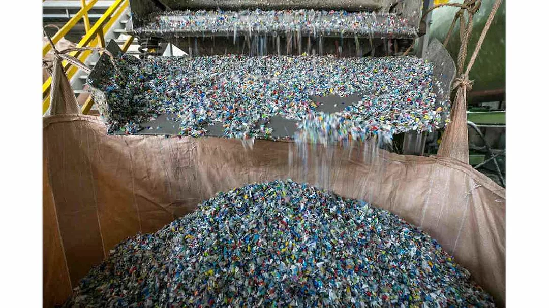 Plastic feedstock being shredded into flakes 