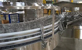 Image of glass jars being moved on conveyor