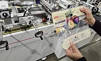 Fox Packaging LDPE stand-up pouch bag on conversion line. 