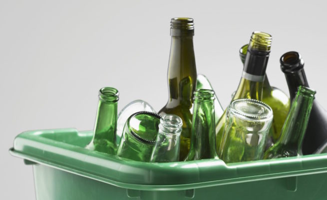 Image of wine bottles in a recycling bin