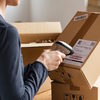 Person scanning a label on a box