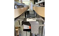 A new printer mounting kit from Deitz Co. enables food, pharmaceutical and nutritional product manufacturers to mount a printer underneath the company's PharmafillTM BCV1 Bottomless Conveyor and automate lot traceability coding on bottle bottoms.