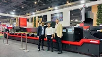multitec Multitec representatives in front of mid-web press.