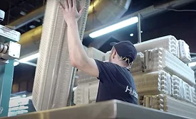 Image of Huhtamaki employee working with molded fiber products.