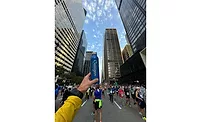Chicago marathon participant holds their Culligan aluminum water bottle