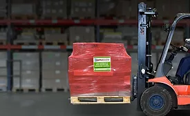 Forklift-carrying-SupplySentry-labeled-shrink-wrap.png