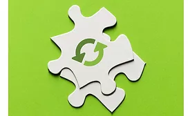 Image of recycling icon on a puzzle piece