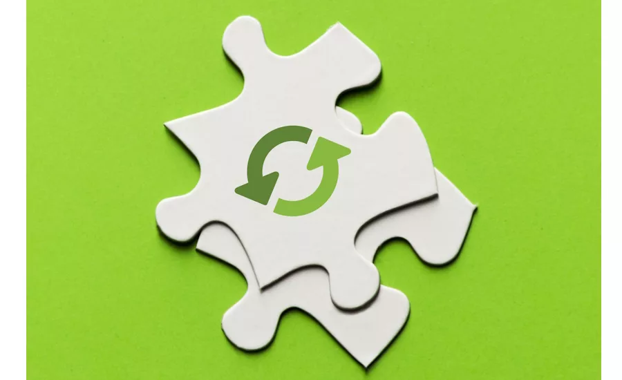 Image of recycling icon on a puzzle piece