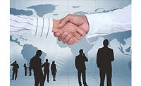 Image of two people shaking hands indicating completed business deal.