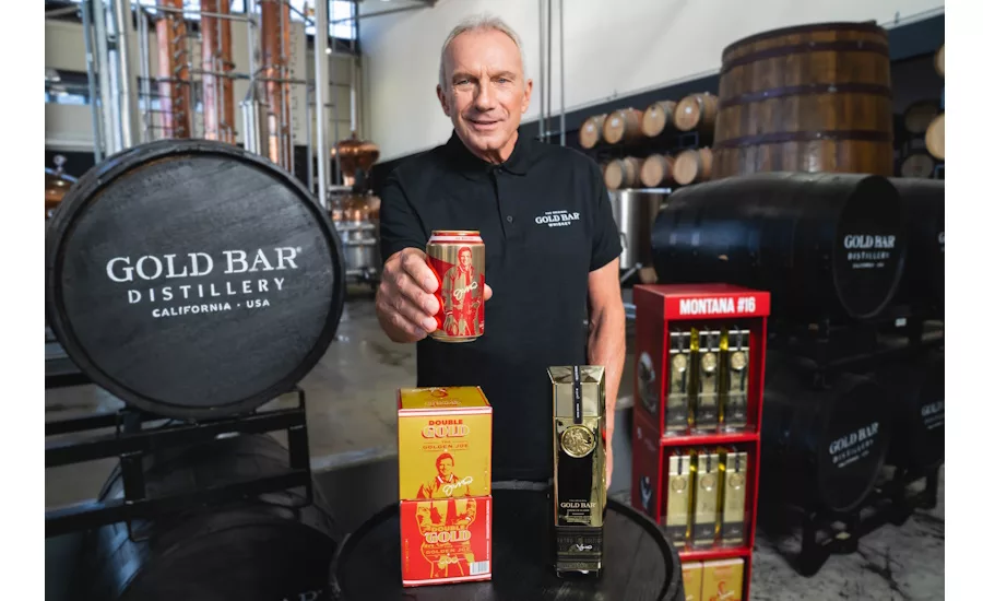 Joe Montana showing Gold Bar Whiskey’s new canned packaging.