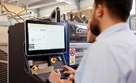 Image of employees using a minimum packaging size calculator