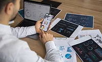 office worker performing data analytics Image of office worker performing data analytics