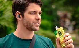 Man-holding-ALCA-spouted-pouch.png