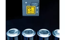 Cans that have been laser-marked with the Domino F720i.