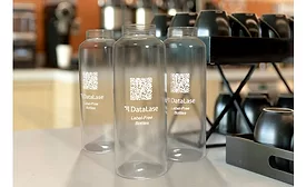 Image of plastic bottles featuring DataLase’s label-free, clear-to-white coating, eliminating the need for traditional labels.