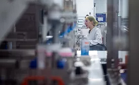 Image of an employee working in a food manufacturing facility.