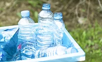 Image of used water bottles in a recycle bin