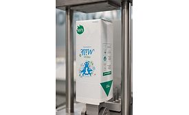 Image of a milk carton on a filling line for fresh milk filling.