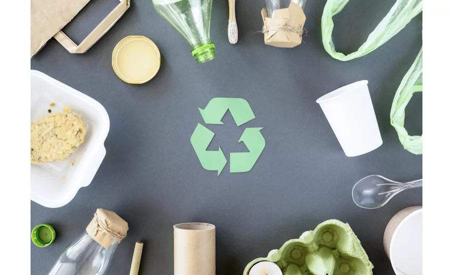 Image of plastic and carton packaging surrounding a recycle symbol.