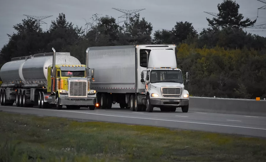 Image of trailer trucks on highway.
