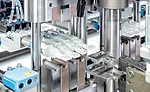 A shearing motion of the separating tool separates vials from the blocks