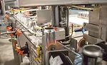 Axon EZ-100 Shrink Sleeve Applicator applying labels to cans