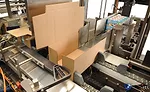 Cross pushing collated packaging into a case via side loader