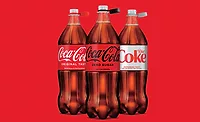 Coca-Cola bottles with attached caps