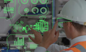 Factory worker employing Movicon.NExT HMI/SCADA software
