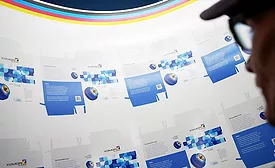 Shop employee inspects print job