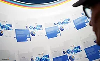Shop employee inspects print job