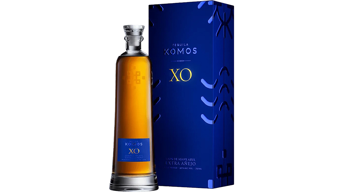 Bottle of Tequila Komos alongside secondary packaging
