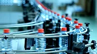 2024 State of Converting feature image of water bottles conveyor in a factory 2024 State of Converting feature image of water bottles on a conveyor in a factory.