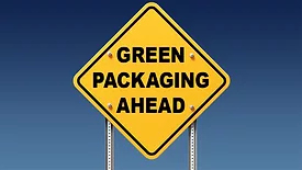 Yellow traffic sign with "Green Packaging Ahead" on blue sky background
