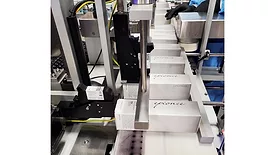 Image of Epionce skin care products on a conveyor belt.