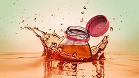 Image of a bottle with a tethered cap