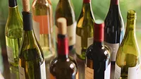 Variety of wine bottles on table.