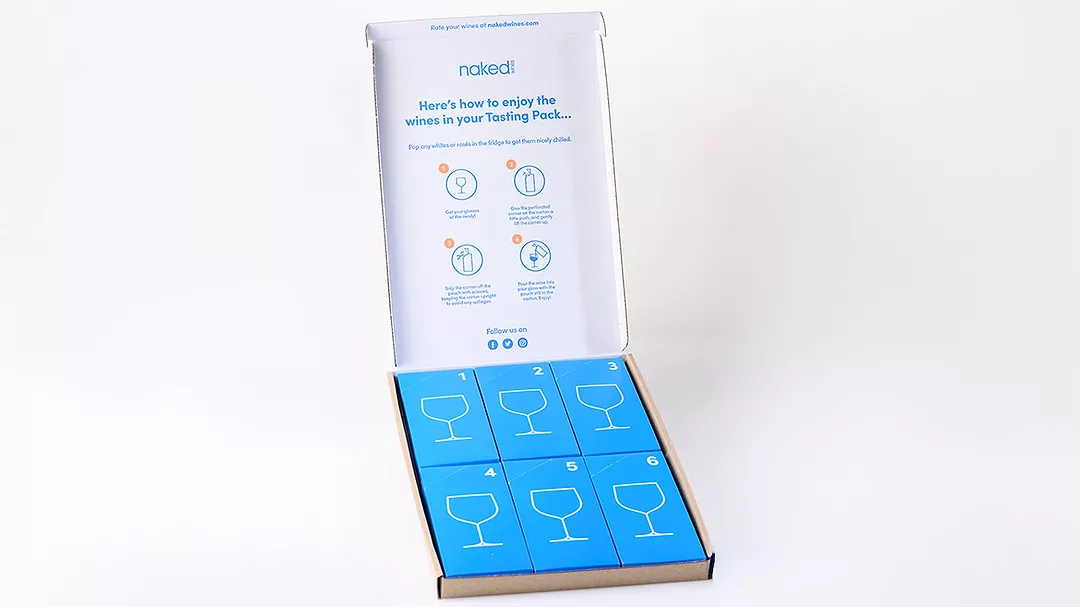 Image of box filled with ecoSIP containers against a white background.