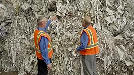 Don Gaines, CEO of Mid America Paper Recycling, inspects paper bales at his facility in Chicago.