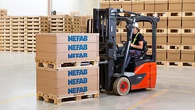Forklift operator loading pallet with Nefab EdgePak Collar