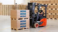 Forklift operator loading pallet with Nefab EdgePak Collar