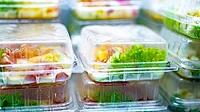 Pre-packaged meals displayed in a commercial refrigerator