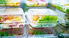 Pre-packaged meals displayed in a commercial refrigerator