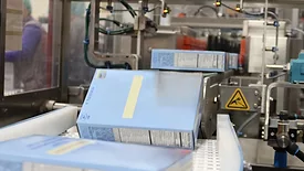 A bag-in-box product moves down the conveyor of the Alterion CL-170 cartoner at the GreenSeed plant.