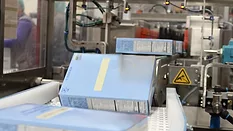 A bag-in-box product moves down the conveyor of the Alterion CL-170 cartoner at the GreenSeed plant.