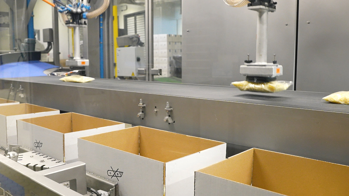 Product packaging in the factory showcasing different conveyors.