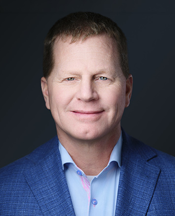 Headshot of Rick Calhoon, Senior Vice President, Operations, Menasha Packaging Company