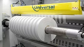A high-precision demonstration of the Universal X8 performing narrow-web slitting and rewinding on a white substrate.