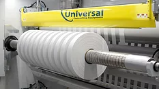 A high-precision demonstration of the Universal X8 performing narrow-web slitting and rewinding on a white substrate.